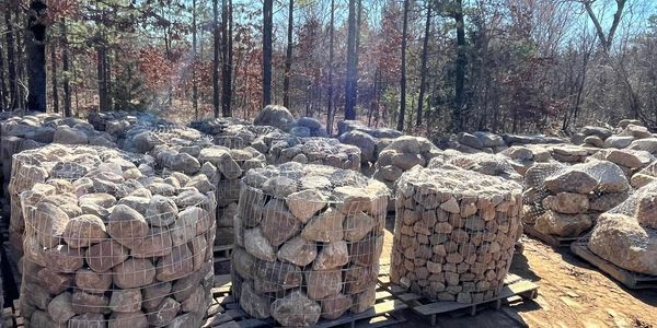 River boulders in wire pallet cages